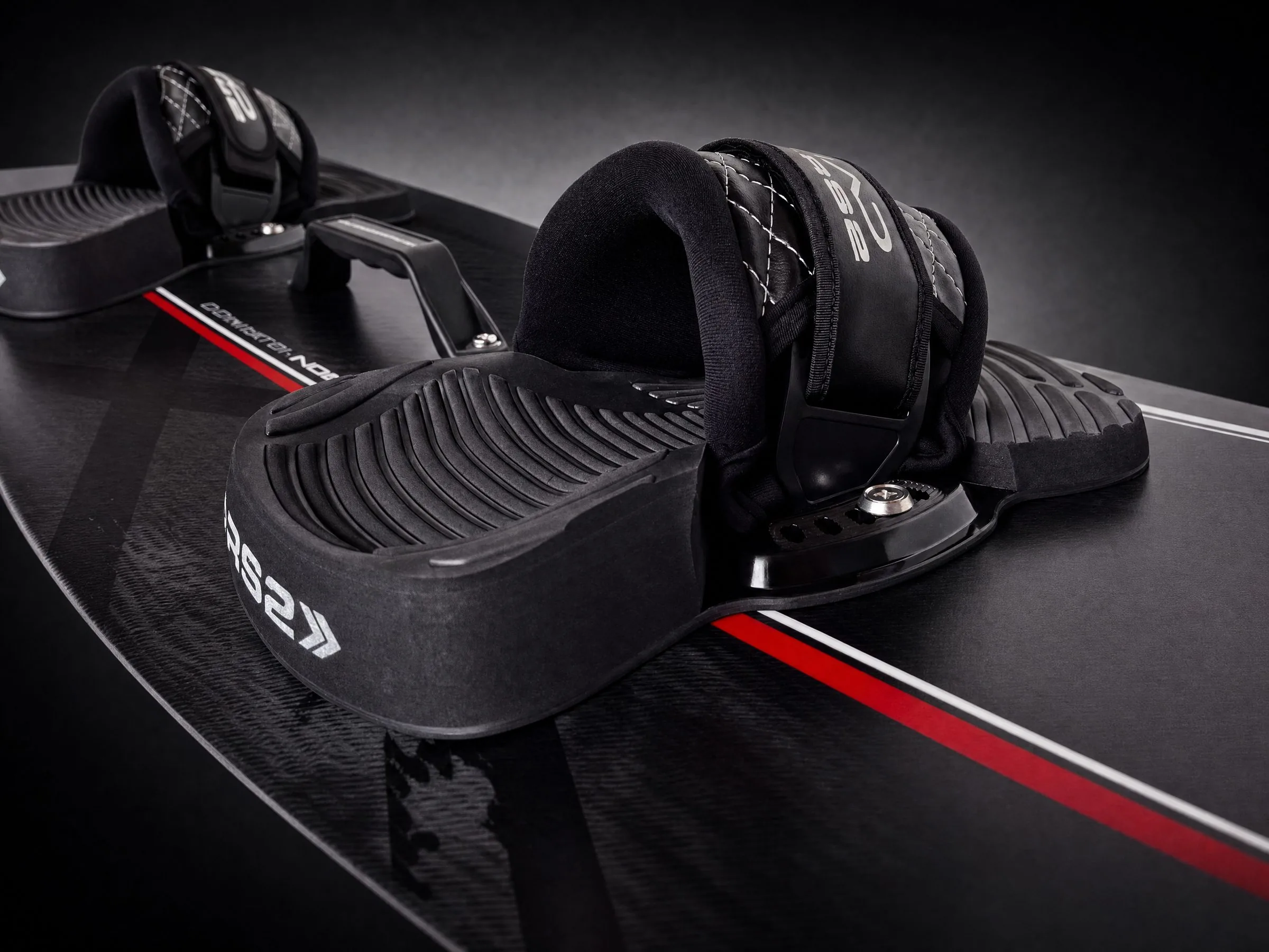 RS2 kiteboard footpads and straps fitted to a Nomad twin-tip kiteboard